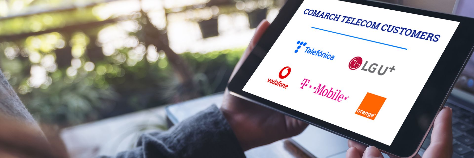 Tablet displaying logos of telecom customers including Telefónica, LGU+, Vodafone, T-Mobile etc